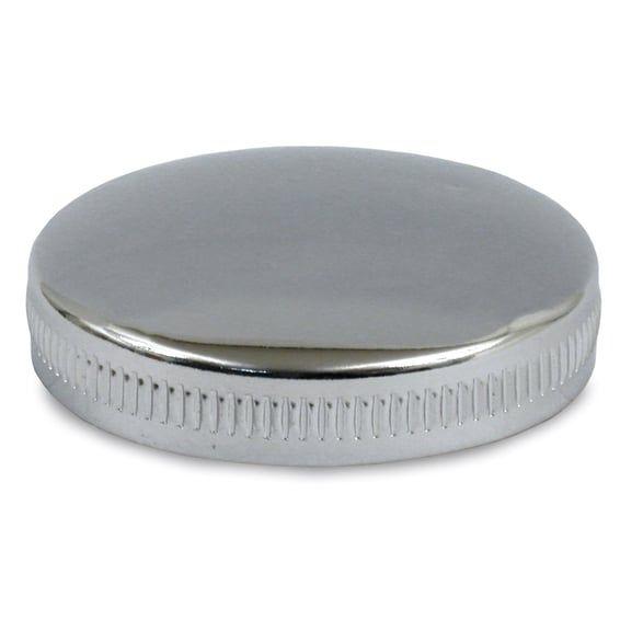 Early bayonet style gas cap, vented right side. Chrome